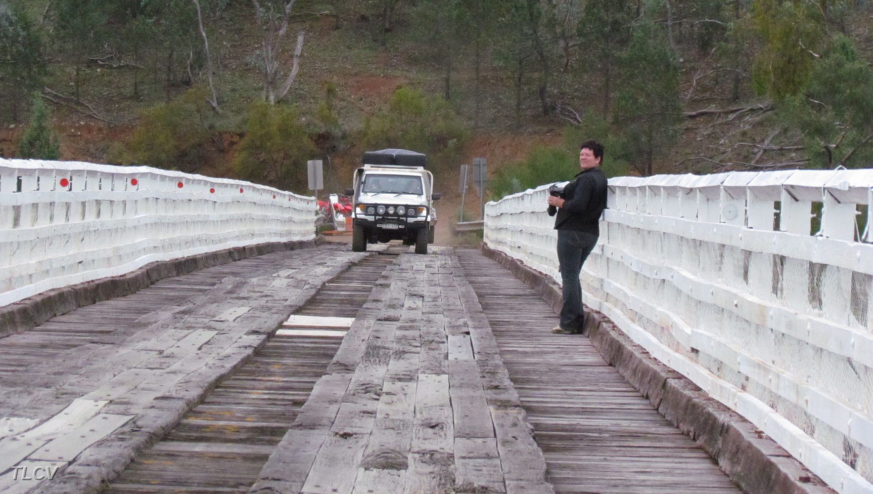 20-Helen watches another convoy cross McKillops Bridge.JPG